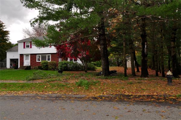 6 Brent Road Lexington, MA 02420 - Photo 2 of 9 a front view of a house with a yard