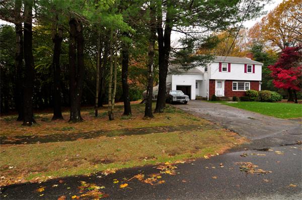 6 Brent Road Lexington, MA 02420 - Photo 3 of 9 a view of a white house with a large trees