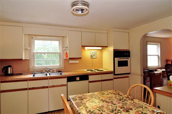6 Brent Road Lexington, MA 02420 - Photo 6 of 9 a kitchen with stainless steel appliances granite countertop a sink a stove and a refrigerator