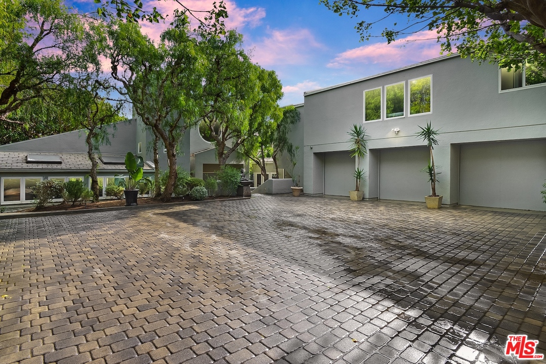 5832 Kanan Dume Road Malibu, CA 90265 - Photo 1 of 1 a front view of a house with garden