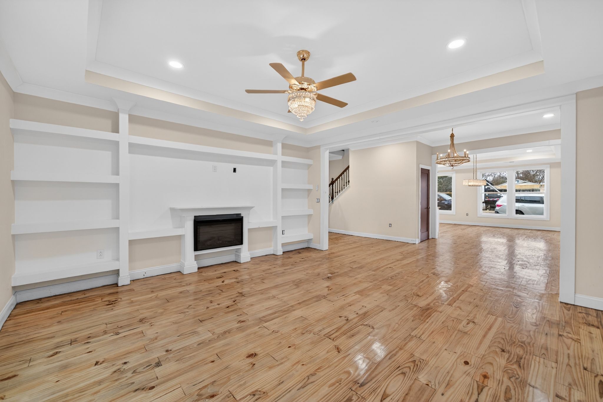 410 3rd Avenue Fayetteville, TN 37334 - Photo 12 of 49 a view of a livingroom with a fireplace a ceiling fan and wooden floor