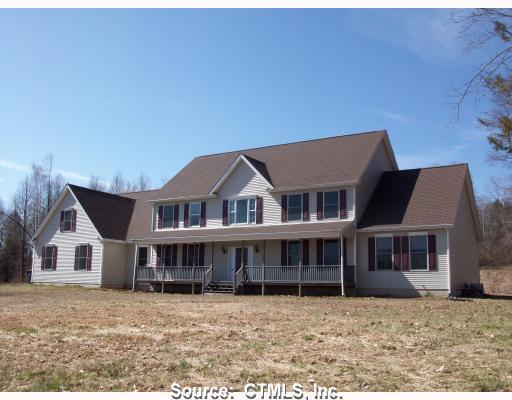 a aerial view of a house with a yard