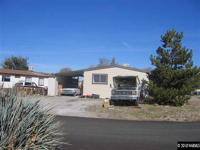 105 Gemini Circle Reno, NV 89521 - Photo 3 of 13 a front view of a house with a yard