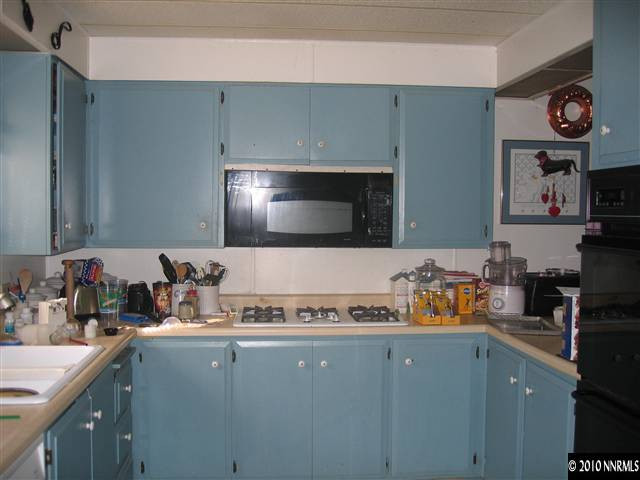 105 Gemini Circle Reno, NV 89521 - Photo 10 of 13 a kitchen with a sink a stove and cabinets