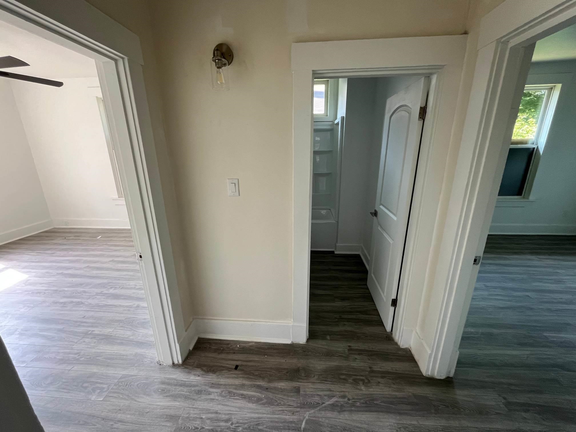 1131 Rozelle Street Memphis, TN 38106 - Photo 14 of 19 a view of a hallway with wooden floor and staircase