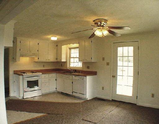 1963 Poteet Road Hardy, VA 24101 - Photo 2 of 5 a kitchen with a stove a sink and a refrigerator