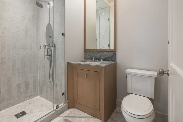 a spacious bedroom with a bed and a window