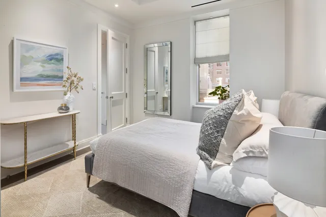 a bathroom with a toilet a sink and shower