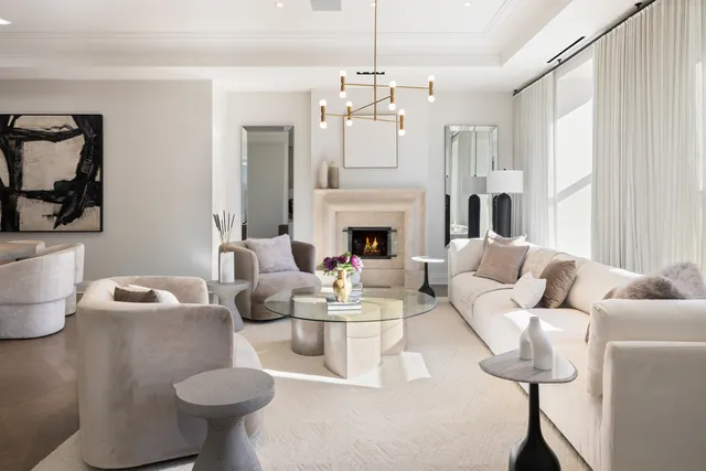 a bedroom with a bed and painting on the wall