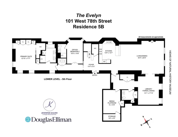 a living room with furniture a fireplace and kitchen view