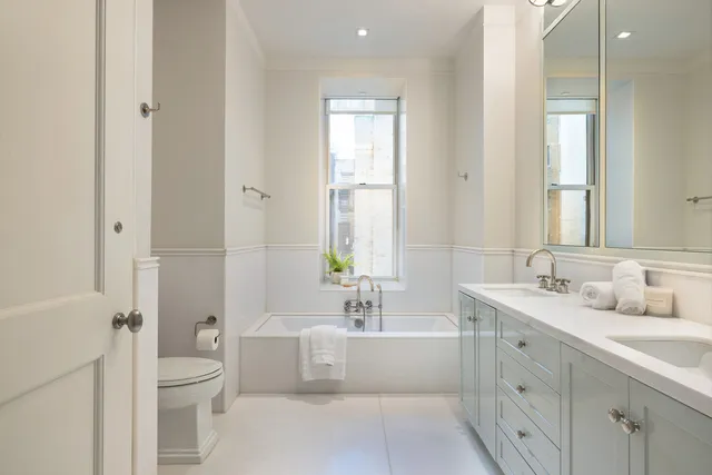a kitchen with stainless steel appliances a stove and cabinets
