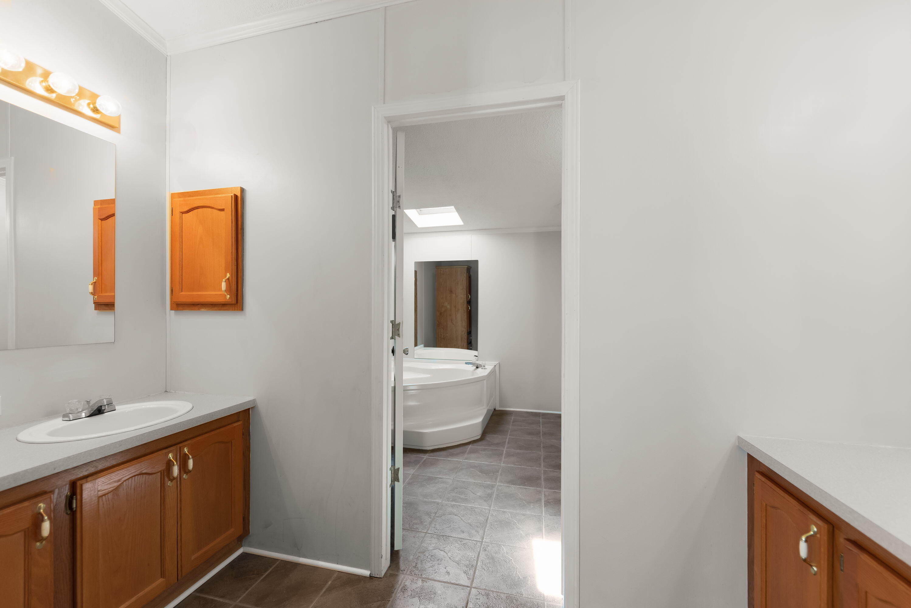 4678 West Schultz Road La Porte, IN 46350 - Photo 13 of 26 a bathroom with a toilet sink and mirror