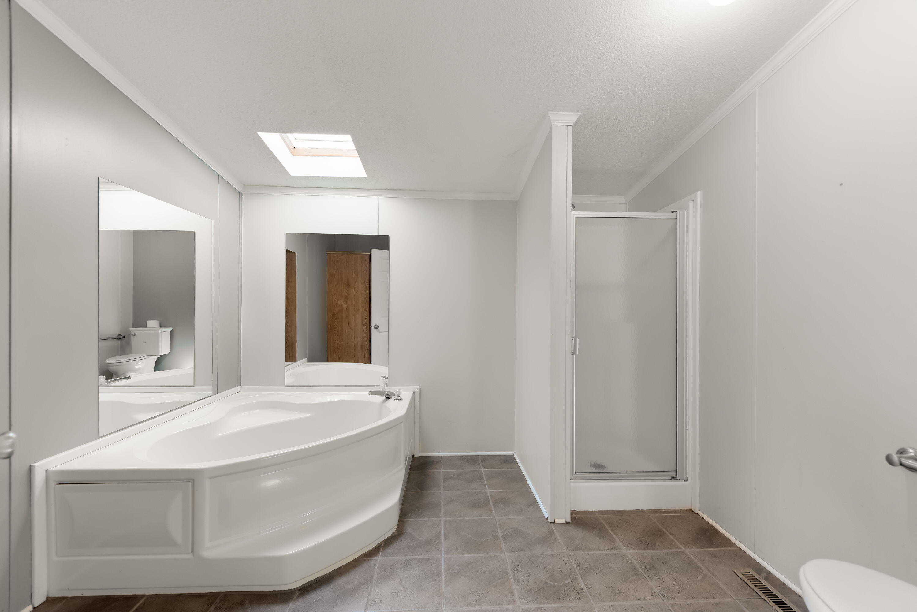4678 West Schultz Road La Porte, IN 46350 - Photo 14 of 26 a bathroom with a sink a toilet and mirror
