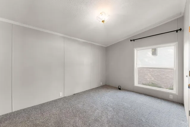 an empty room with a empty space and windows