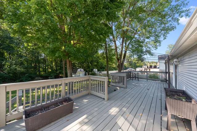 a view of balcony with deck and wooden floor