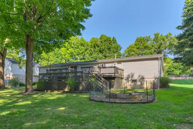 a view of a house with backyard and a slide