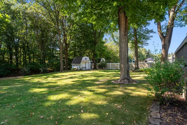 a swimming pool with trees in the background