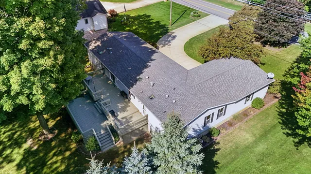 an aerial view of a house with outdoor space and street view
