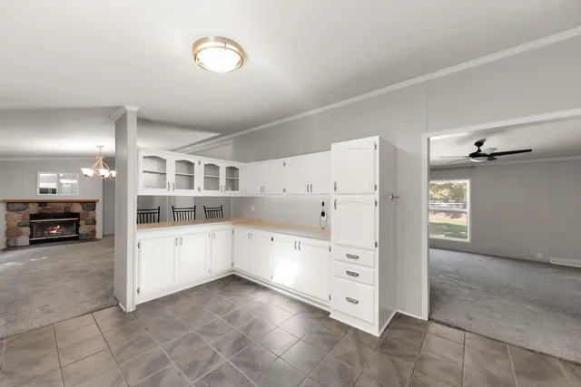 a view of a kitchen with furniture and cabinets