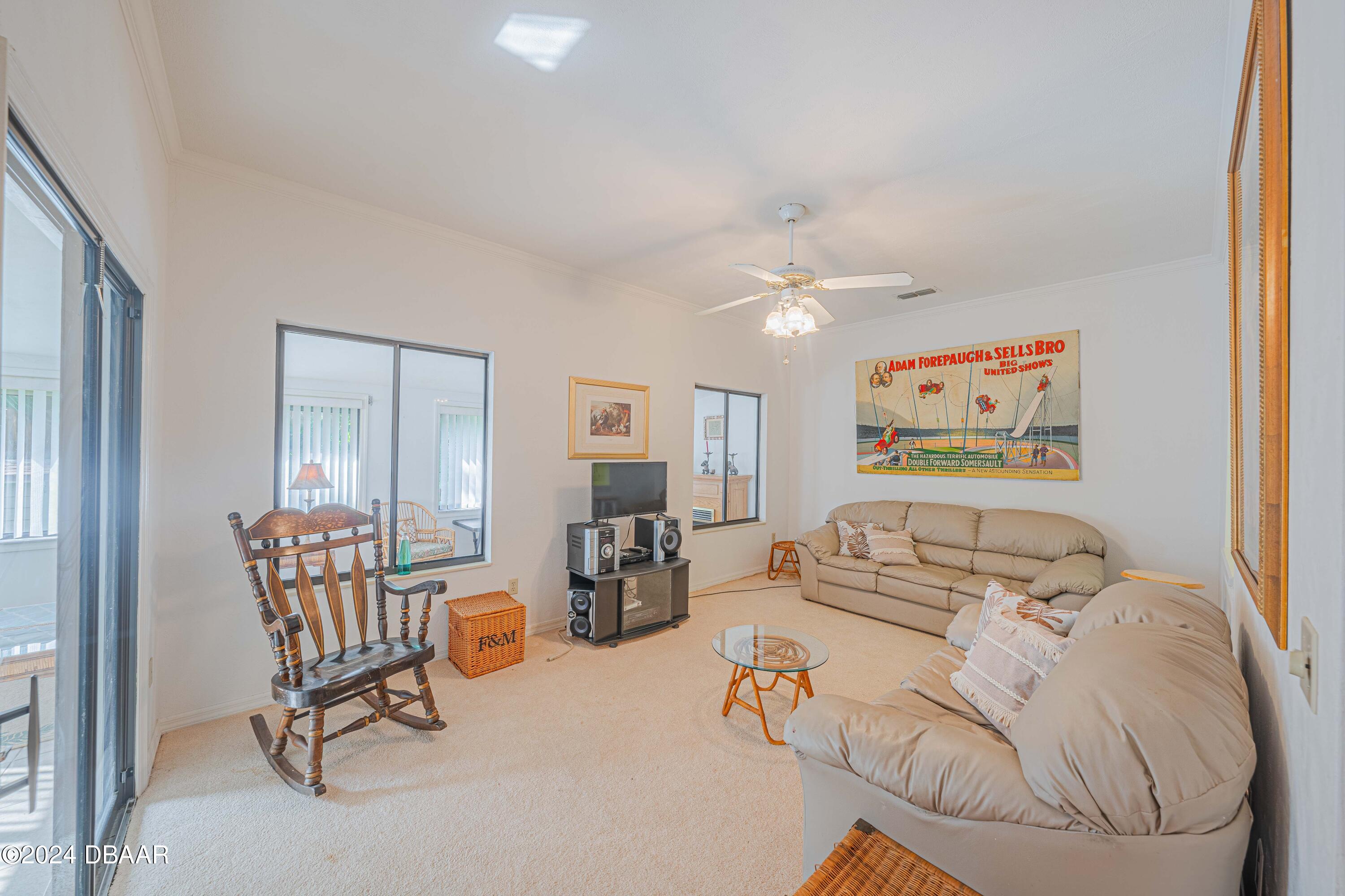42 Jana Drive Ponce Inlet, FL 32127 - Photo 15 of 34 a living room with furniture and a table