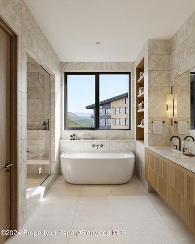a spacious bathroom with a tub sink and mirror