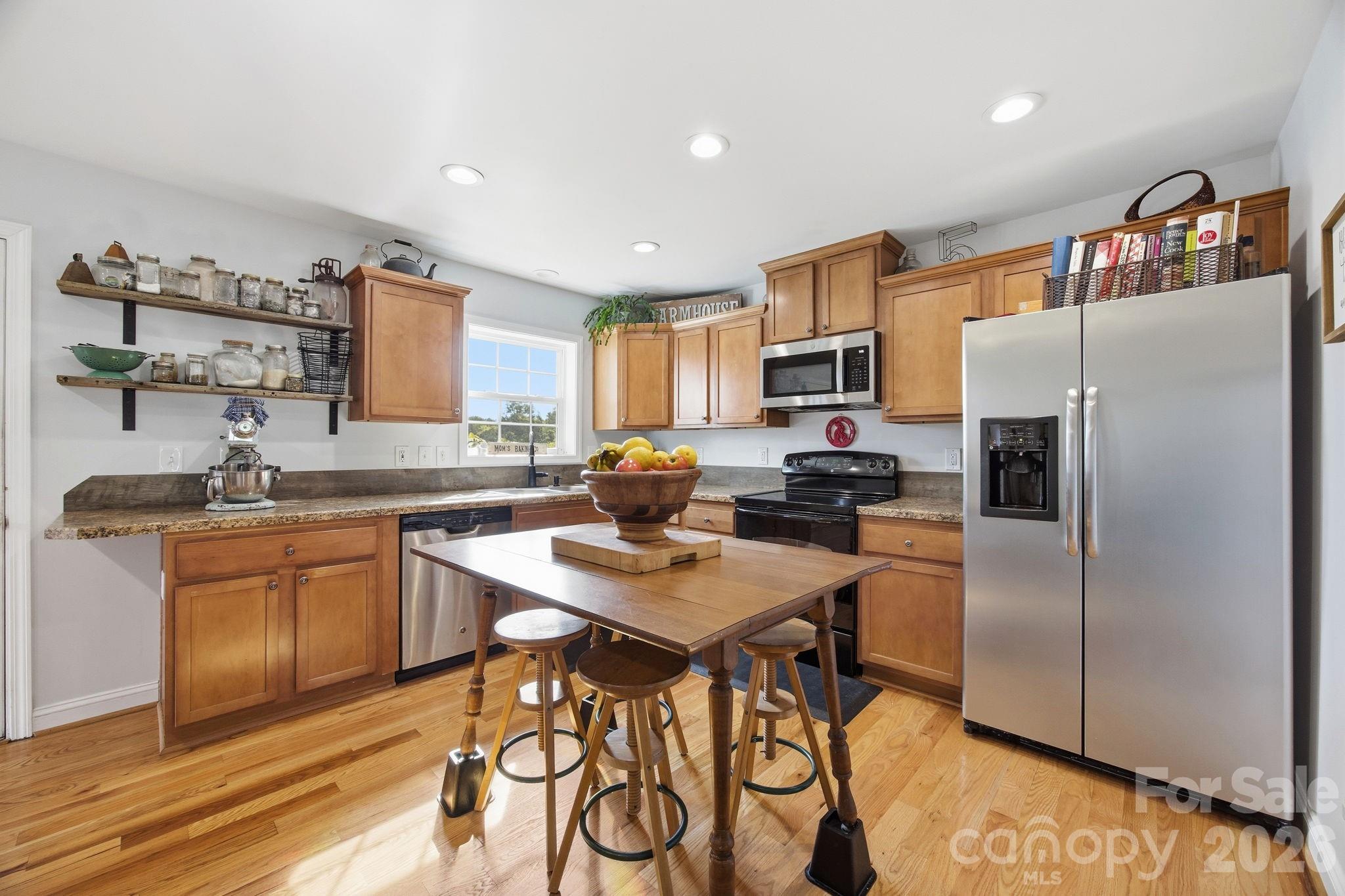 3480 Skyline Road Rock Hill, SC 29730 - Photo 12 of 40 a kitchen with stainless steel appliances granite countertop a refrigerator and a stove top oven
