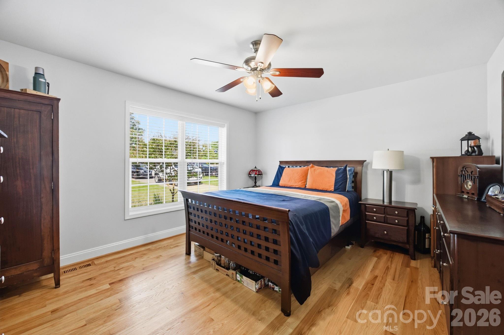 3480 Skyline Road Rock Hill, SC 29730 - Photo 16 of 40 a bedroom with a bed and wooden floor