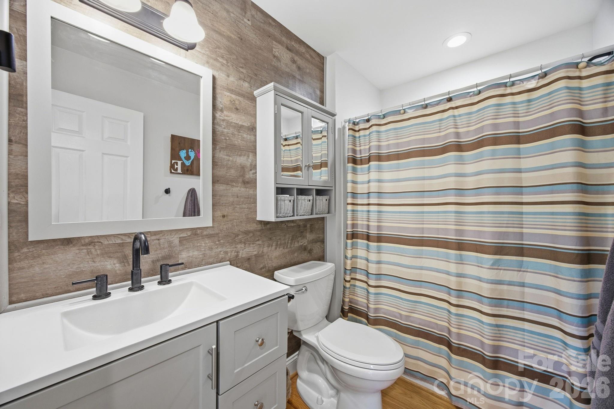 3480 Skyline Road Rock Hill, SC 29730 - Photo 23 of 40 a bathroom with a sink a toilet a shower and a mirror