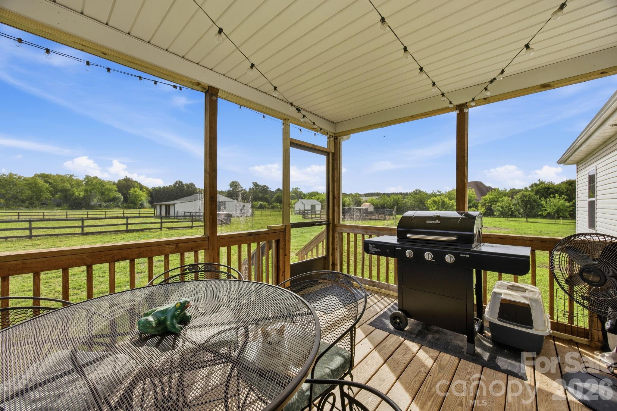 3480 Skyline Road Rock Hill, SC 29730 - Photo 25 of 40 a view of a patio with chairs next to a yard