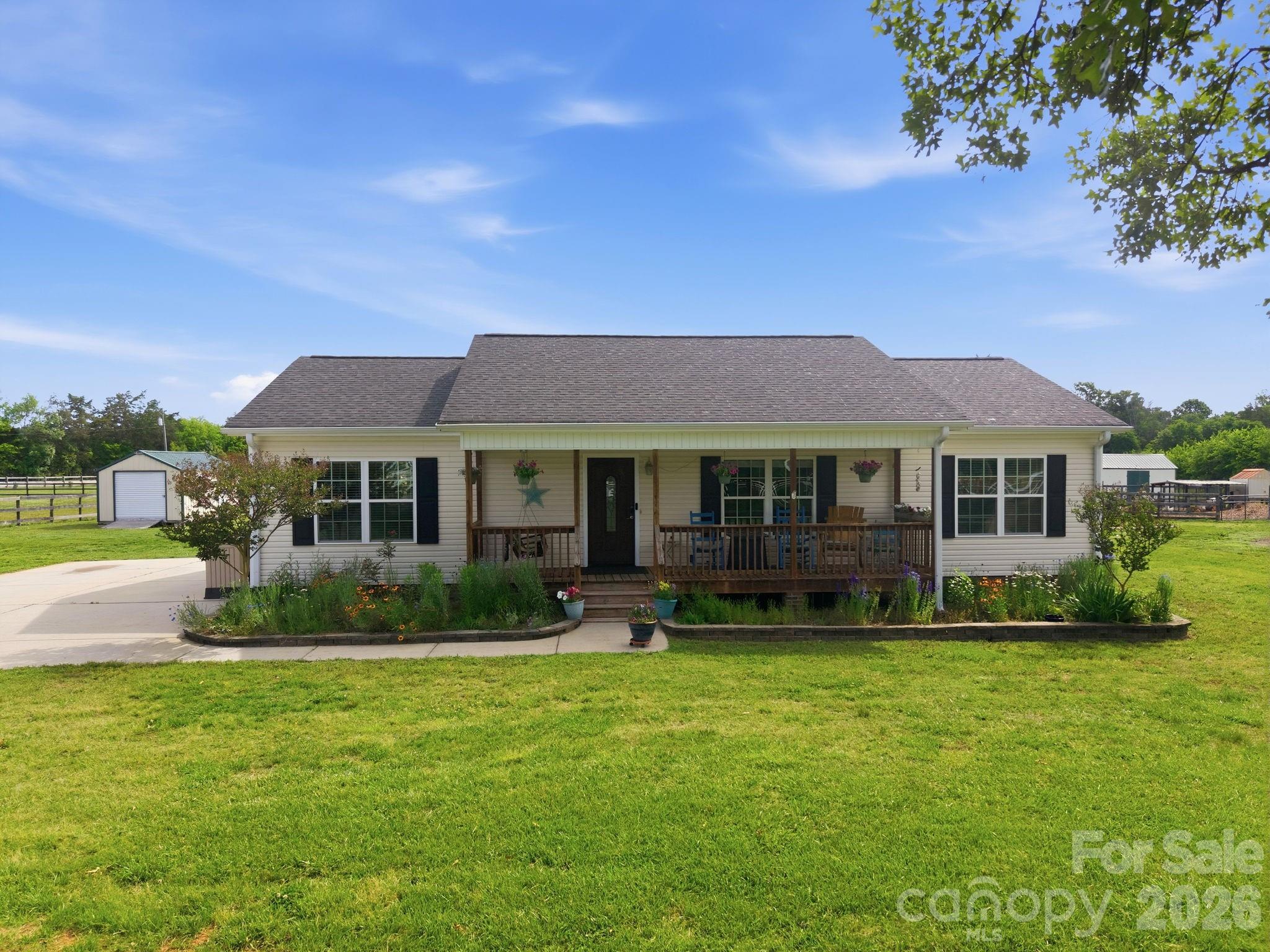 3480 Skyline Road Rock Hill, SC 29730 - Photo 4 of 40 a front view of a house with a garden and yard
