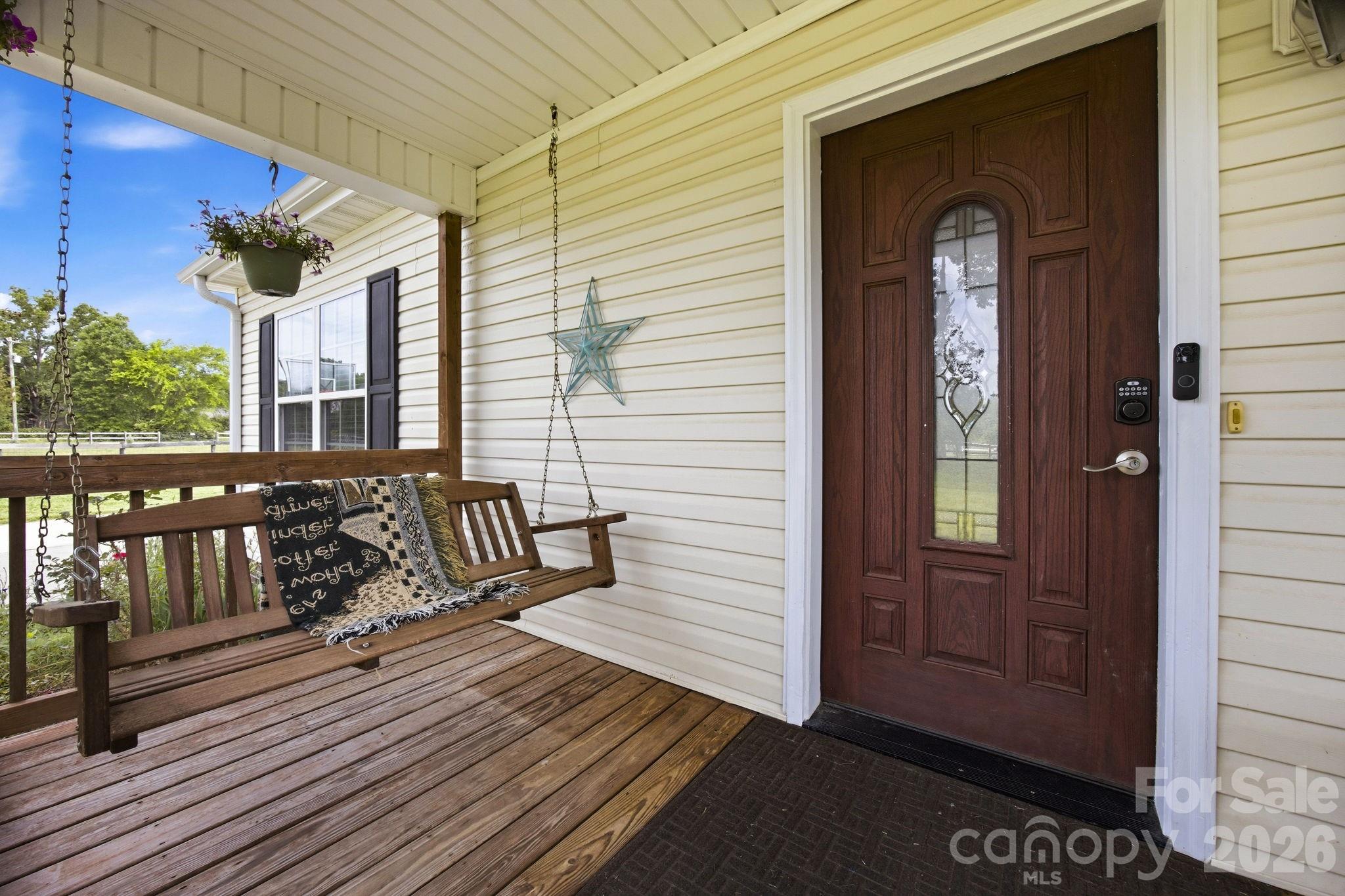 3480 Skyline Road Rock Hill, SC 29730 - Photo 7 of 40 a view of a balcony with chairs and wooden floor