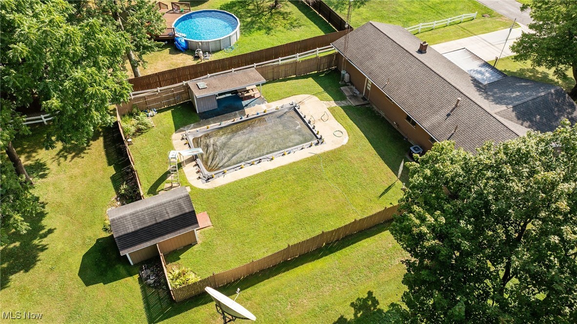 3907 Edwards Street Mineral Ridge, OH 44440 - Photo 9 of 45 Aerial view of property and surrounding area with a pool area