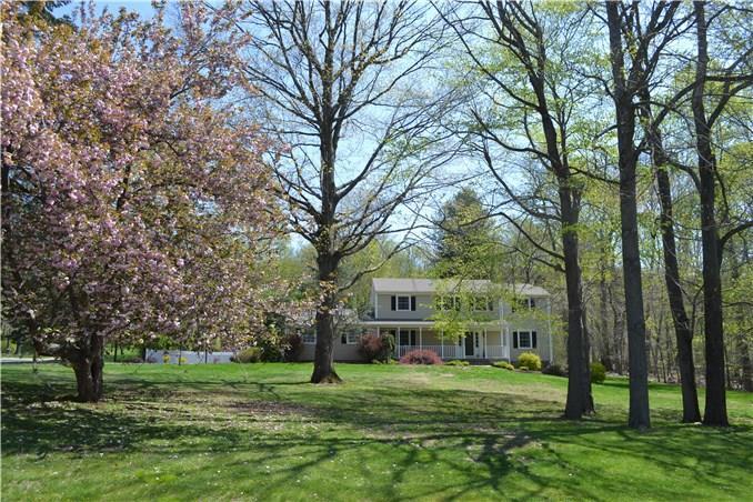 59 Deepdene Road Trumbull, CT 06611 - Photo 1 of 1 a view of a big yard with plants and large trees
