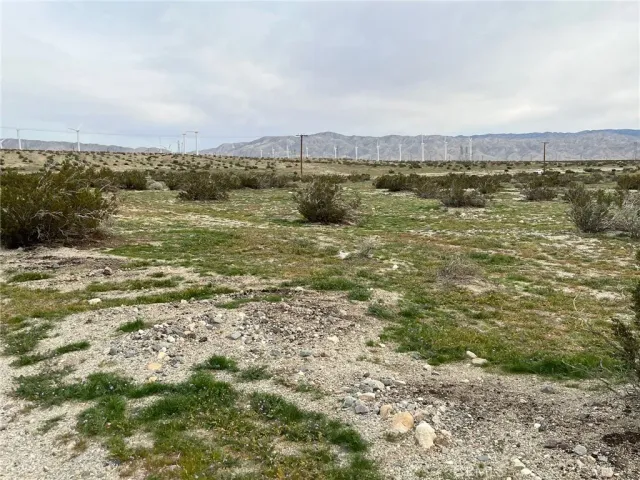 a view of a lake view with houses in the back