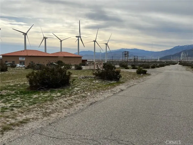 a view of a street with a building in the background