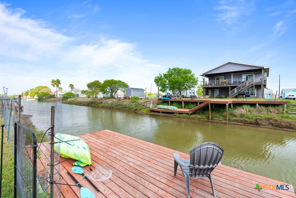 239 Allen M Parks Drive Rockport, TX 78382 - Photo 4 of 29 a view of a lake with a table and chairs