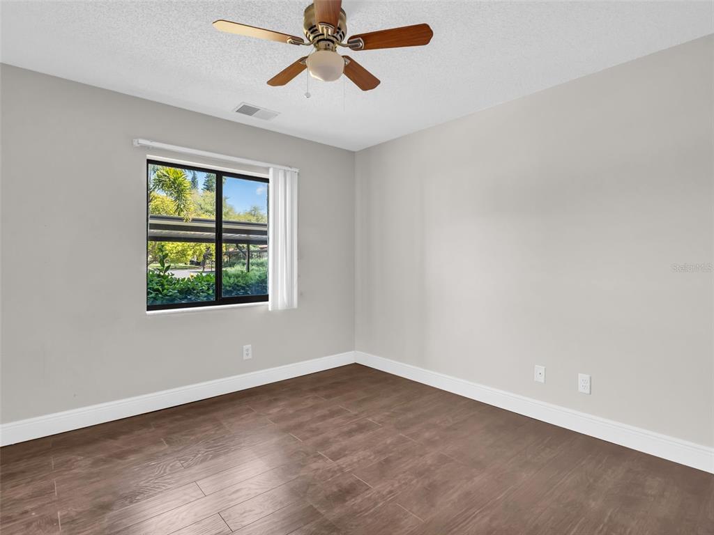 1801 East Lake Road South, Unit 20C Palm Harbor, FL 34685 - Photo 41 of 56 an empty room with a window