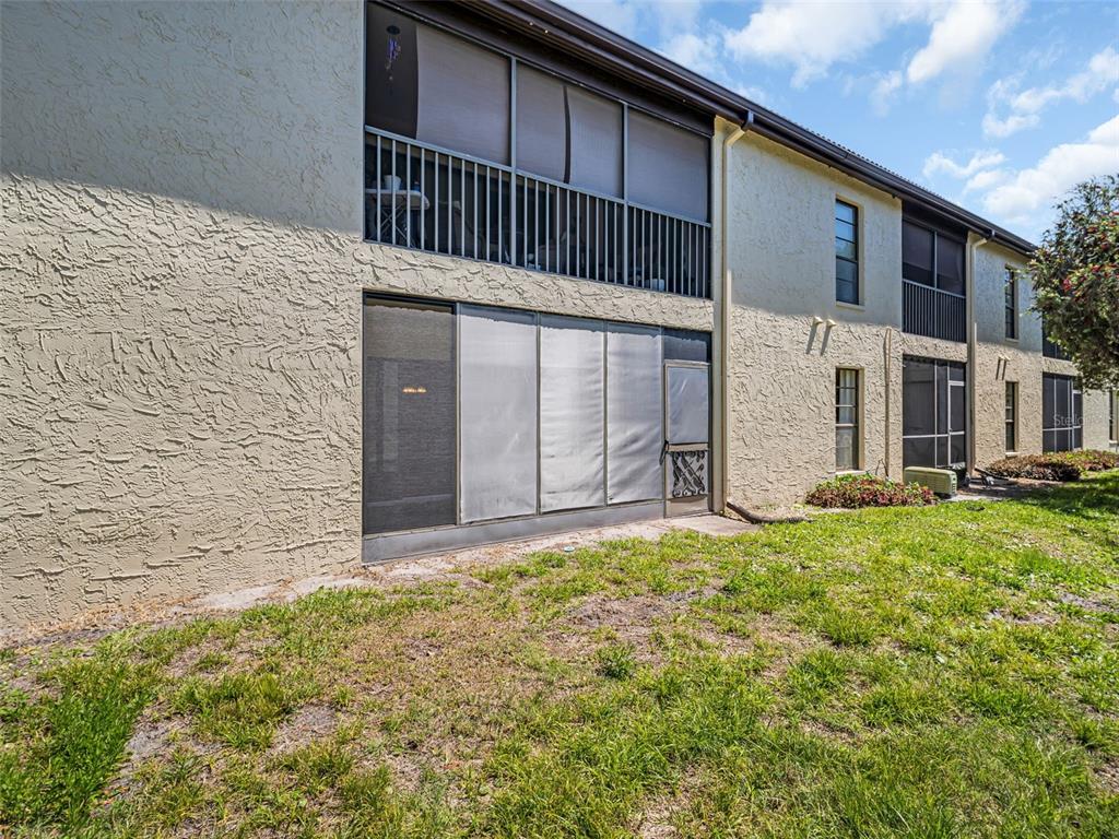 1801 East Lake Road South, Unit 20C Palm Harbor, FL 34685 - Photo 53 of 56 a view of a house with backyard