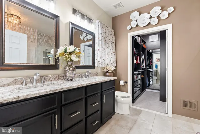 a bed room with a bed and a television