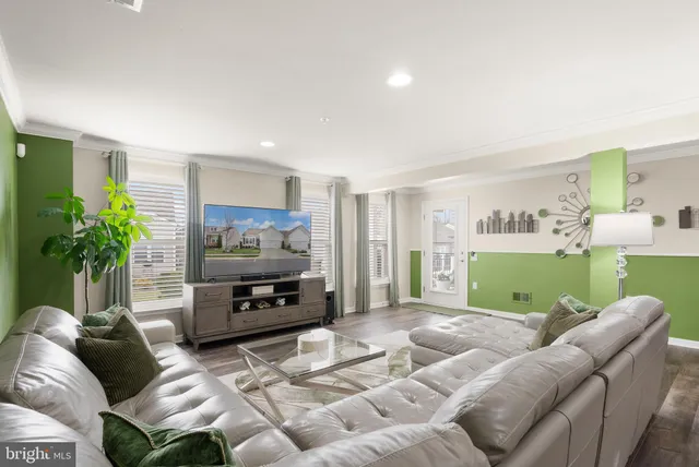 a front view of a house with a yard table and chairs