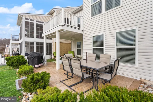 a view of a house with a big yard and large trees