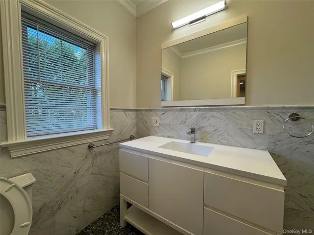 a bathroom with a shower and a sink