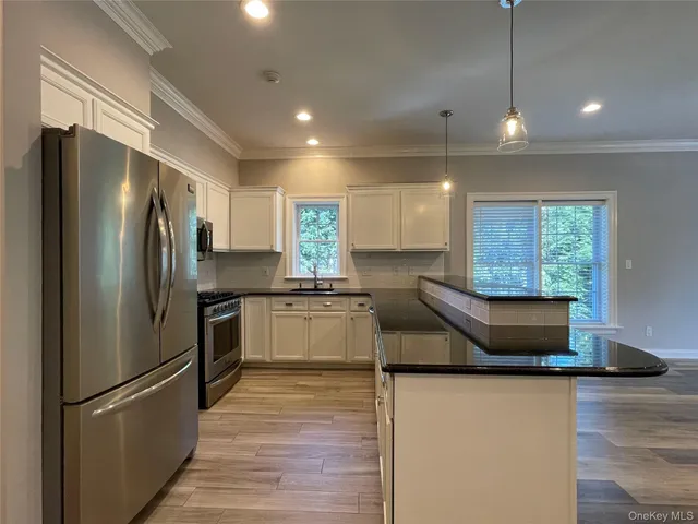 a view of a kitchen and a sink