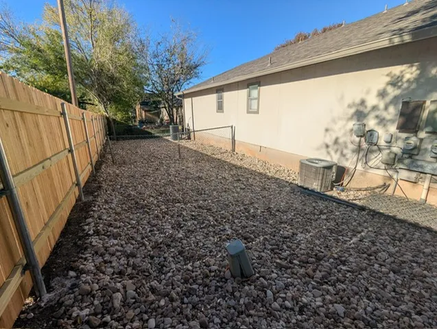 a view of a backyard with pathway