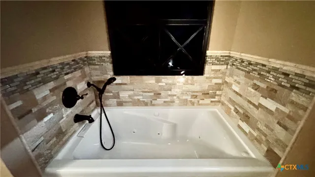 a bathroom with a bathtub