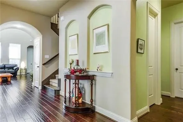 a view of living room with furniture and wooden floor