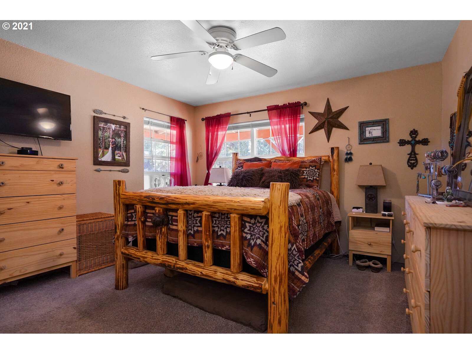 9310 Harmony Road Sheridan, OR 97378 - Photo 13 of 32 a bedroom with furniture and a flat screen tv
