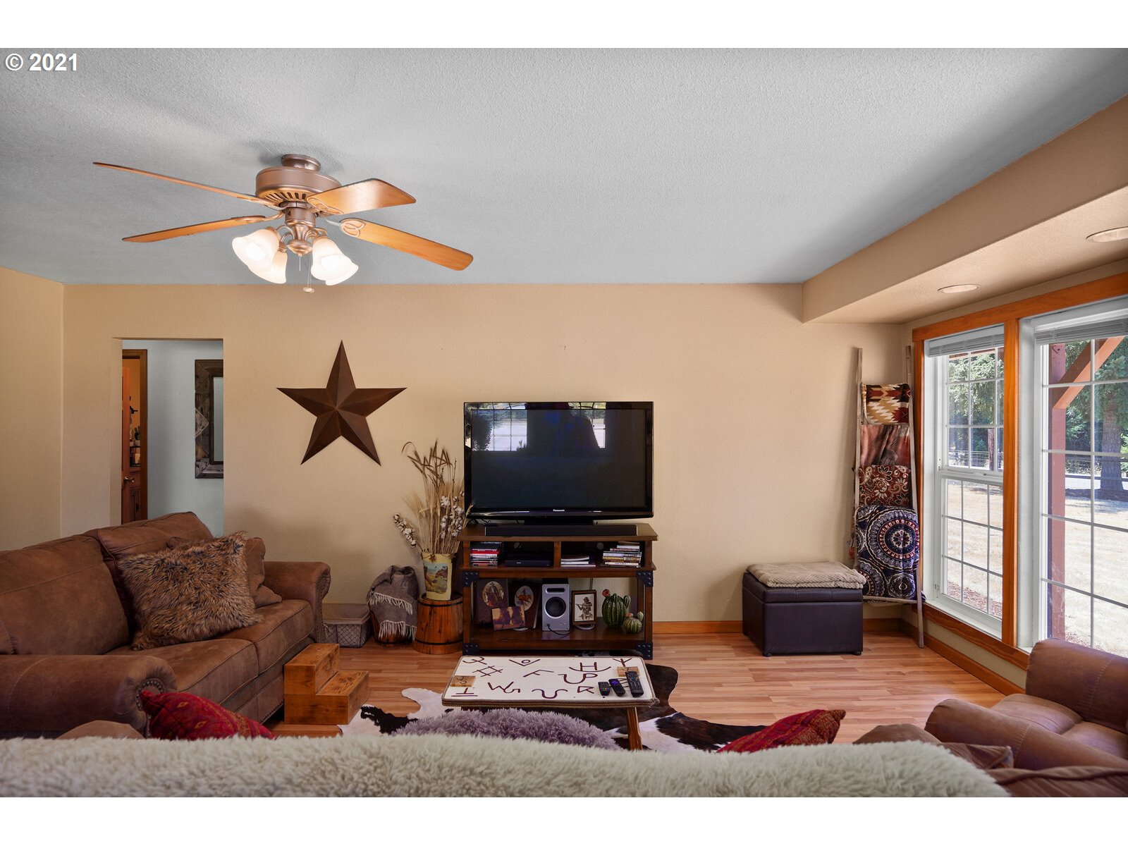 9310 Harmony Road Sheridan, OR 97378 - Photo 17 of 32 a living room with furniture and a flat screen tv