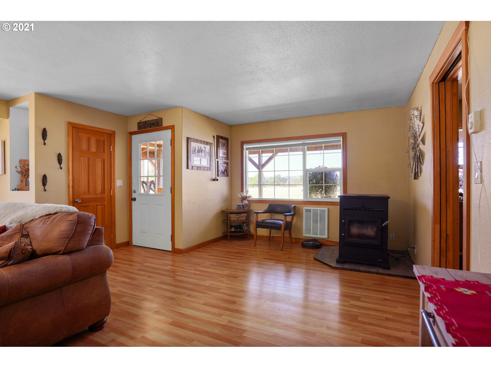 9310 Harmony Road Sheridan, OR 97378 - Photo 18 of 32 a living room with furniture and a flat screen tv