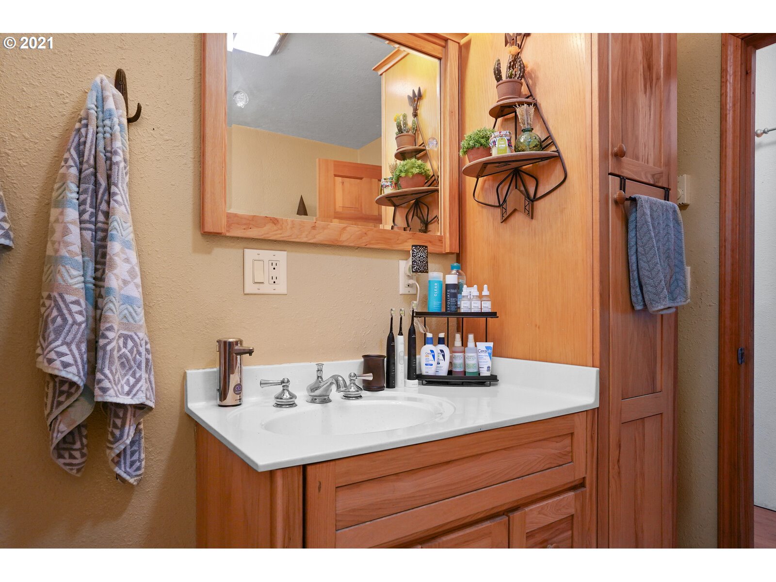 9310 Harmony Road Sheridan, OR 97378 - Photo 20 of 32 a bathroom with a sink and mirror